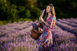 © Xalanx - Young woman with a basket in a lavender field