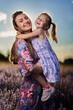 © Xalanx - Happy mother and daughter in a lavender field