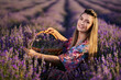 © Xalanx - Young woman with a basket in a lavender field