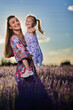 © Xalanx - Happy mother and daughter in a lavender field