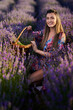 © Xalanx - Young woman with a basket in a lavender field