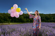 © Xalanx - Woman with balloons in a lavender field