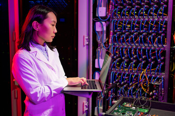 Poster - Busy Asian Network Engineer Analyzing Data