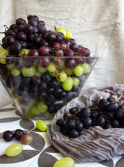 Poster - Grapes in a vase. Close up photo of fresh seasonal fruits. Eating fresh concept. Beautiful grapes on a table. Summer berries texture. 