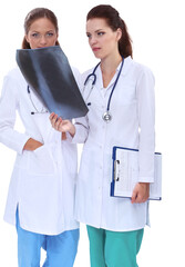 Two woman nurse watching X Ray image, standing in hospital