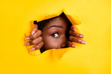 Photo Of Charming Interested Woman Ripped Torn Blank Space Look Through Bright Yellow Color Background