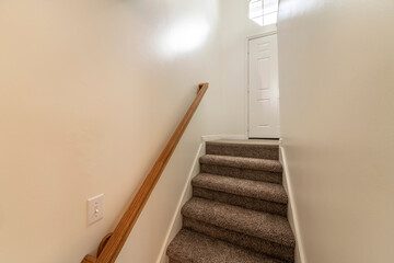 Wall Mural - Interior of a basement stairs in a house with window and lights