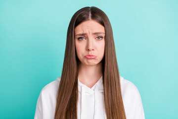 Canvas Print - Photo of cute abused young woman dressed white hoodie crying isolated teal color background