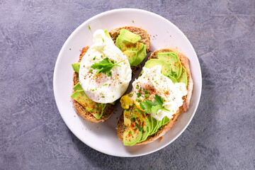 Wall Mural - sandwich toast with avocado and poached egg
