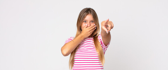 blonde pretty woman laughing at you, pointing to camera and making fun of or mocking you