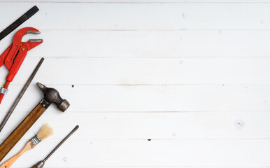 set of instruments with text space on white wooden background with copyspace