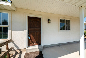 Sticker - Exterior of a house with closed dark wooden door and windows