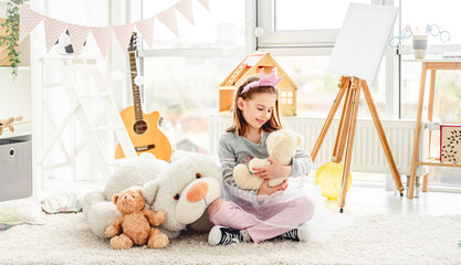 Poster - Lovely little girl playing with teddy bears in beautiful room