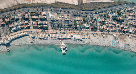 Wall Mural - aerial view of (Poetto beach ) seashore of the city of (Cagliari) with salinas field - Sardinia - Italy.