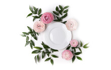 Top View Of Beautiful Table Setting With Flowers And White Plate