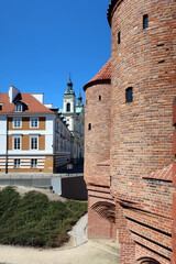 Wall Mural - Old Town in Warsaw, Poland.  Historic Barbican - element of medieval defense construction, an important component of city fortifications