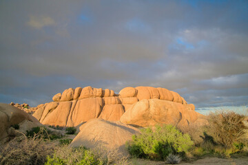 Wall Mural - Amazing giant rocks against gray cloudy sky at Joshua Tree National Park