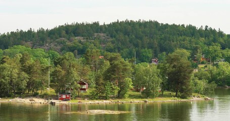 Wall Mural - Swedish Wooden Sauna Log Cabin House On Island Coast In Summer Cloudy Day