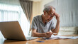 © Kawee - Depressed Asian Senior Elderly male feel worry about financial problem