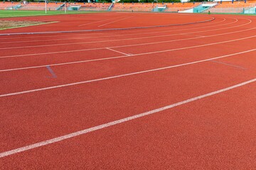 Wall Mural - The curved lane in running track or athlete track in stadium. Running track is a rubberized artificial running surface for track and field athletics