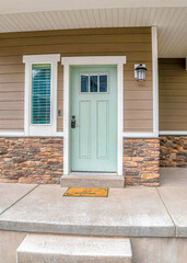 Wall Mural - Vertical Front door and sidelight against brick wall and wood siding of home with porch