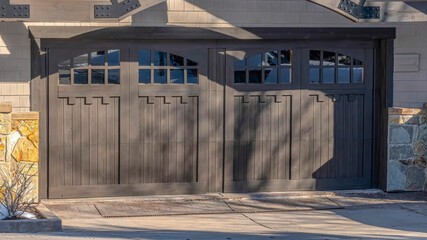 Wall Mural - Pano Entrance to garage of home in Park City with arched glass panes on the door