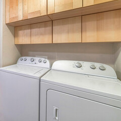 Wall Mural - Square Functional laundry room with appliances and double basin sink and cabinets