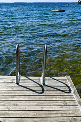 jetty with bathing ladder in lake Vattern Sweden