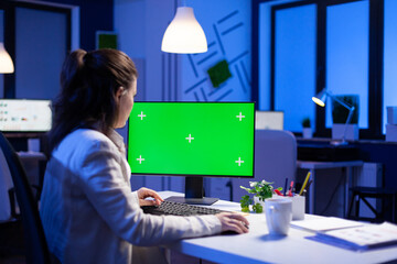 Poster - entrepreneur working in front of green screen display sitting at desk during videocall meeting in bu