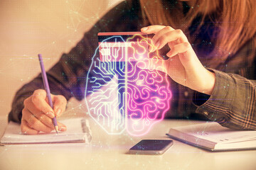 Double exposure of woman on-line shopping holding a credit card and brain hologram drawing. Data E-commerce concept.