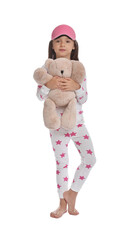 Wall Mural - Cute girl wearing pajamas and sleeping mask with teddy bear on white background