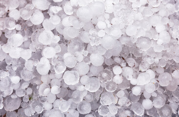 A pile of large hail on the ground