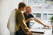© Jacob Lund - Business professionals working together on a laptop