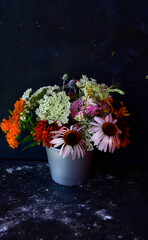 Wall Mural - Bouquet of summer blooming flowers from the garden on a black background, vintage style.