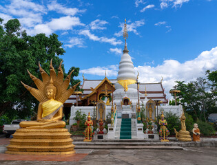 Wall Mural - golden meditated buddha statue with naga covered behind and white pagoda at Wat Phra That Doi Leng Temple on the Mountain with blue sky, travel attraction in Phrae, Thailand