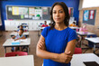 © WavebreakMediaMicro - Portrait of african american female teacher with arms crossed in the class at school