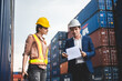 © chokniti - logistic worker teamwork and partner of foreman, engineer, and businessman working in an international shipping area, concept of business industrial and working in container yard to import and export