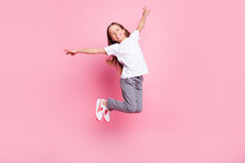 Full Size Profile Photo Of Nice Impressed Blond Girl Jump Wear White T-shirt Isolated On Pastel Pink Color Background