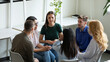 © fizkes - Diverse millennial team discussing mental health problems on group therapy meeting. Recovering addicts getting psychologist and community support, telling own addiction story on rehab session