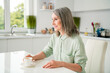 © deagreez - Profile side view portrait of attractive cheerful grey-haired woman drinking espresso staying at home light white indoors
