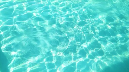 Wall Mural - Ocean rippling turquoise water on the beach, at summer.