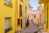 Fototapeta Uliczki - Colorful houses in a scenic small street of Collioure, France, Pyrenees Orientales, Languedoc Roussillon, Cote Vermeille, district of Moure