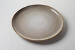 Rustic empty clean mottled brown round pottery plate