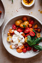 Caprese Salad With Burrata Cheese In A White Bowl