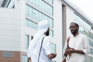 Canvas Print - Men in Islamic Clothes Talking Outdoors