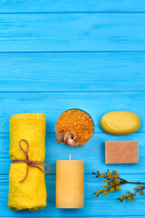 Wall Mural - Yellow salt with terry towel candle and soap flat lay.