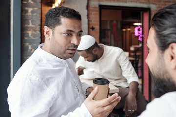 Canvas Print - Arabian Man Drinking Coffee With Friend