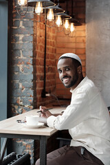Poster - Portrait Of Handsome Guy In Muslim Hat