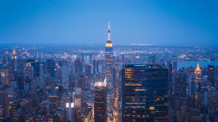Fototapete - New York City Skyline with Urban Skyscrapers at Night Aerial View