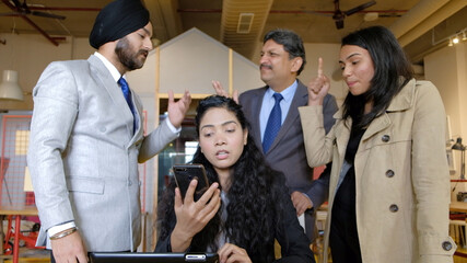 Poster - Group of Indian workers brainstorming during a business meeting in office